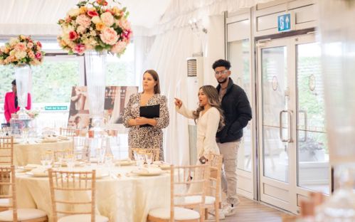 Sian from the wedding team showing a couple around the Grand Pavilion.