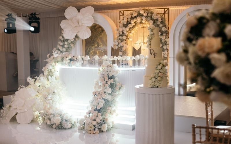 The Grand Pavilion decorated with large white floral displays.