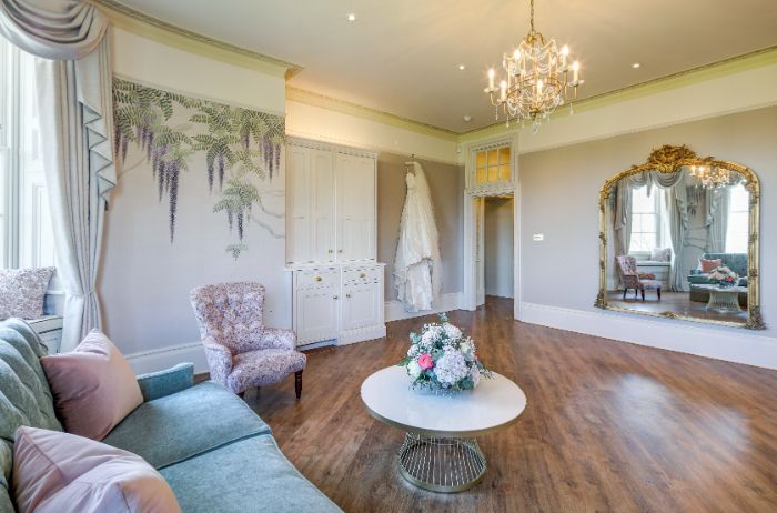 Hylands Estate Wedding Suite Wisteria Room with seating areas and a makeup station. 