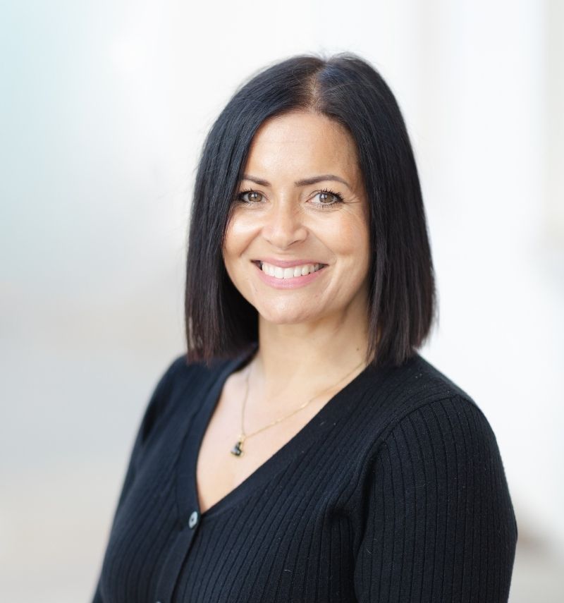 Tracey, a woman with brown eyes and dark, shoulder length hair. 