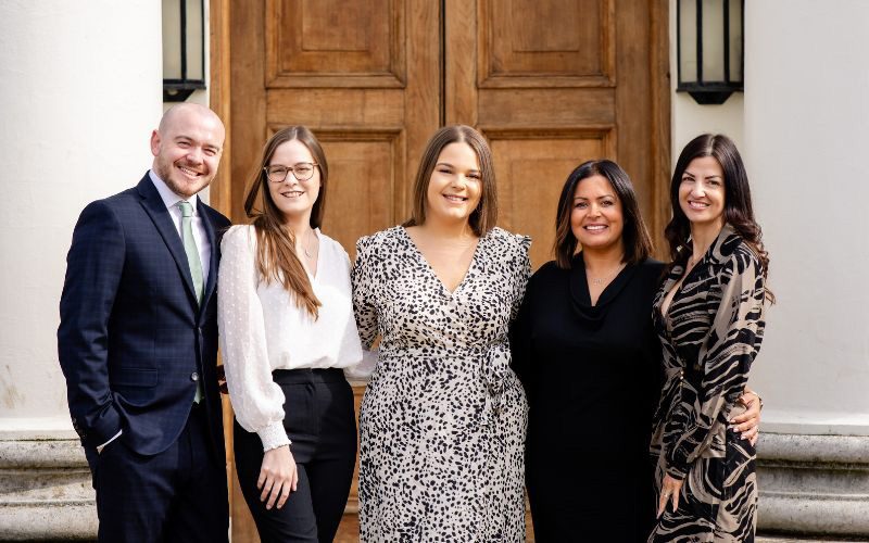 The Weddings and Events team smiling outside Hylands House. From left to right; Tom, Charlotte, Sian, Tracey, Amy.