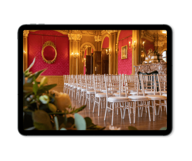 A tablet screen displays the Banqueting Room