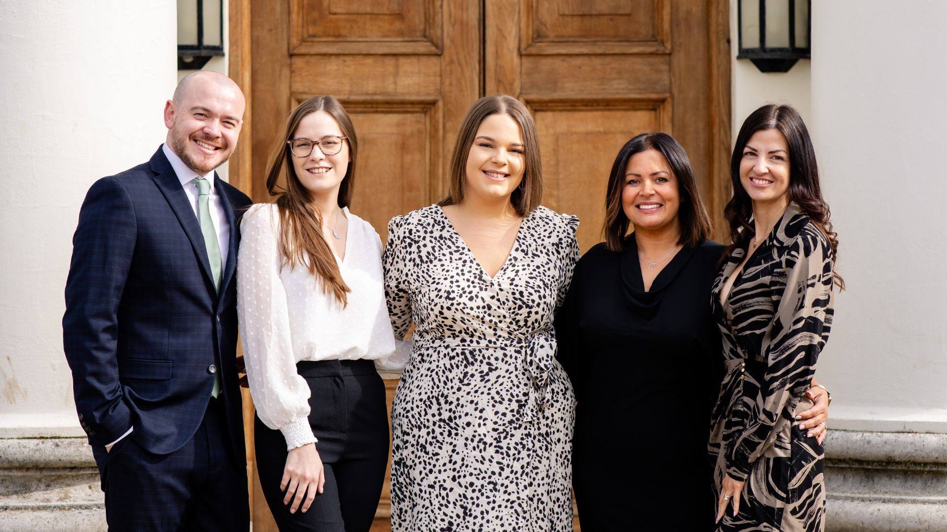 The Weddings and Events team smiling outside Hylands House. From left to right; Tom, Charlotte, Sian, Tracey, Amy.
